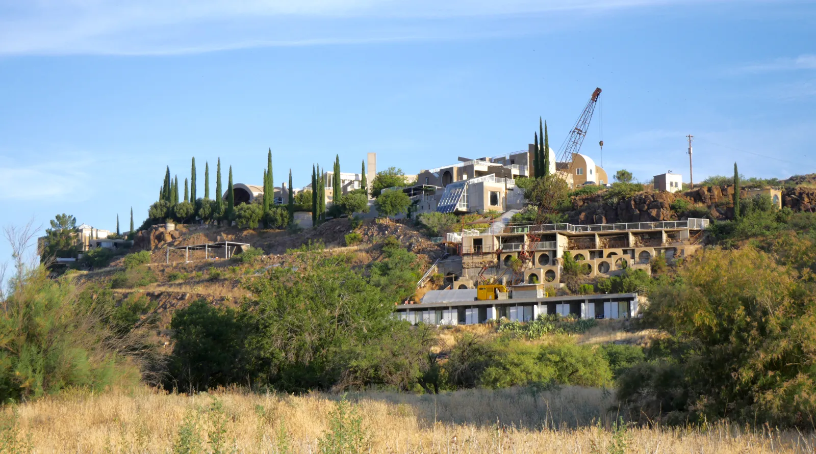 Arcosanti from the southeast — concrete structures nestled into the Arizona high desert landscape