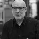 Portrait of Brian Eno, ambient music pioneer, generative systems thinker, and inventor of the scenius concept